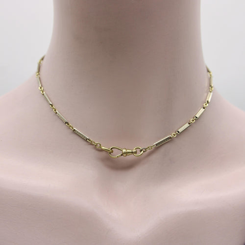 Montre Chaîne de montre Art Déco bicolore en or 10 carats avec fermoir mousqueton et anneau à ressort en or 14 carats 58 Facettes A20057