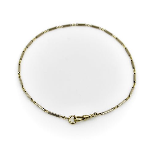 Montre Chaîne de montre Art Déco bicolore en or 10 carats avec fermoir mousqueton et anneau à ressort en or 14 carats 58 Facettes A20057