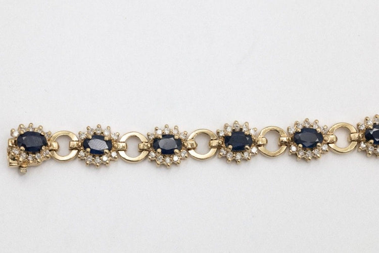Bracelet Bracelet exclusif en or jaune 14k avec saphirs et diamants 58 Facettes 11393