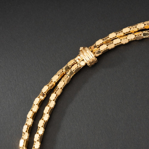Collier Collier en or jaune 18K à deux rangs, signé MELLERIO. 58 Facettes