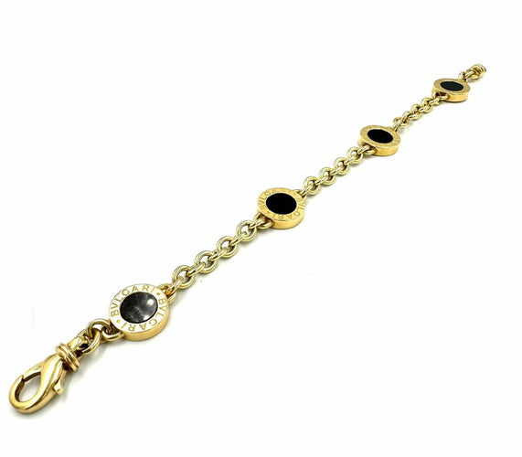 Bracelet BVLGARI. Collection "BVLGARI-BVLGARI", bracelet or jaune et onyx 58 Facettes