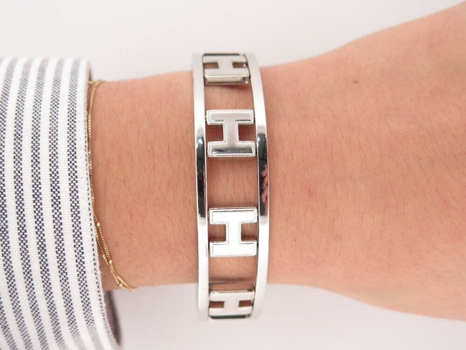 Bracelet bracelet HERMES rondo ash h rotatifs 20cm acier paladie & laque noir 58 Facettes 264585