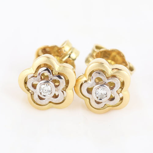 Boucles d'oreilles Boucles d'oreilles en forme de fleur en or jaune et blanc 18 carats avec diamants 58 Facettes 131208