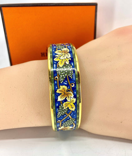 Bracelet HERMÈS - bracelet en métal doré et émail 58 Facettes AB657