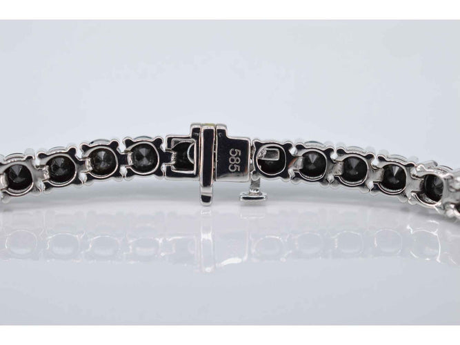 Bracelet Bracelet tennis en or blanc serti de diamants noirs tout autour 58 Facettes 2117