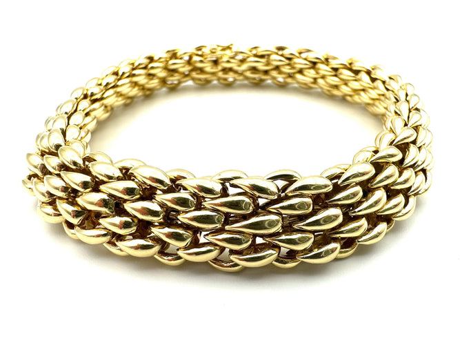Bracelet CHAUMET. Bracelet vintage or jaune 18K 58 Facettes