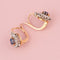 Boucles d’oreilles dormeuses Belle Époque en or rose, platine, saphirs et diamants