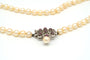 Collier Collier en or blanc, perles et rubis 58 Facettes B278