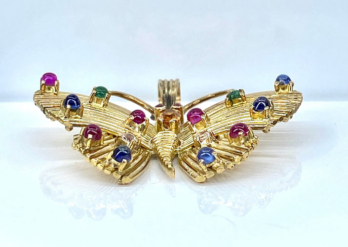 Pendentif papillon en or jaune et pierres précieuses