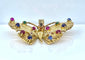 Pendentif papillon en or jaune et pierres précieuses