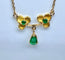 Collier pendentif trilobé en or jaune 18 carats et émeraudes