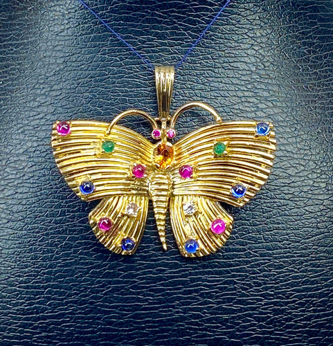 Pendentif papillon en or jaune et pierres précieuses