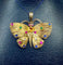 Pendentif papillon en or jaune et pierres précieuses