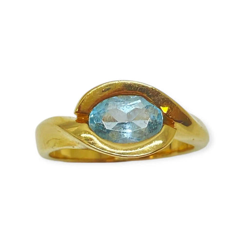 Bague or jaune et topaze bleue