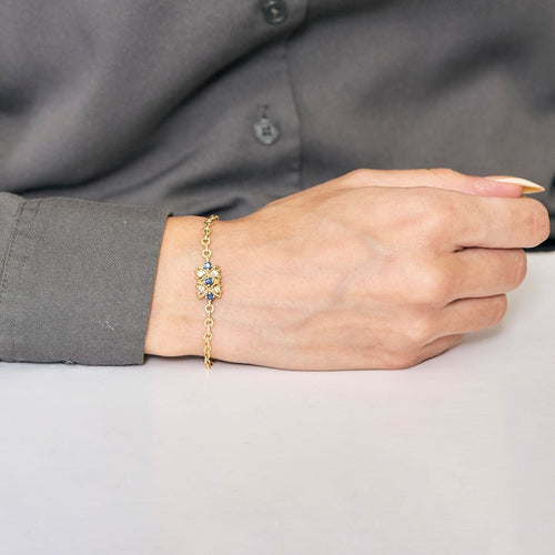 Bracelet Bracelet torsadé en or jaune saphir et diamants. 58 Facettes