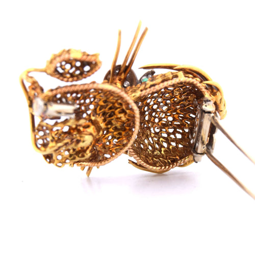 Broche Broche en or jaune et or blanc avec émeraudes et diamants 58 Facettes