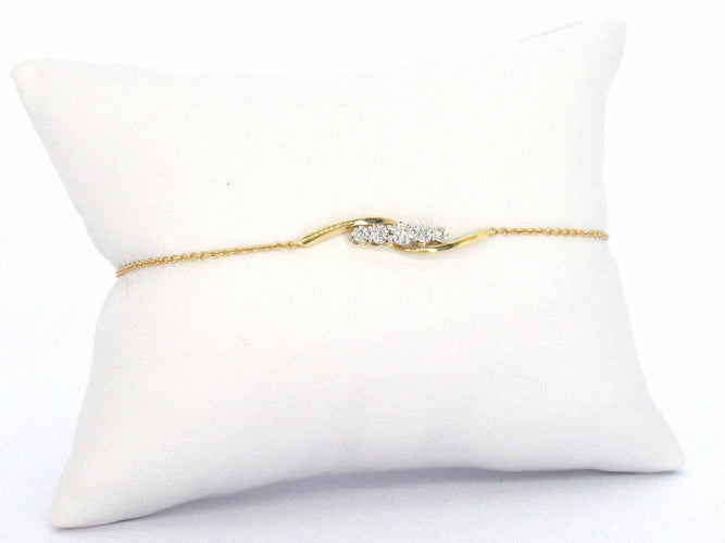 Bracelet Bracelet en or jaune avec diamants sertis en rang 58 Facettes 2361