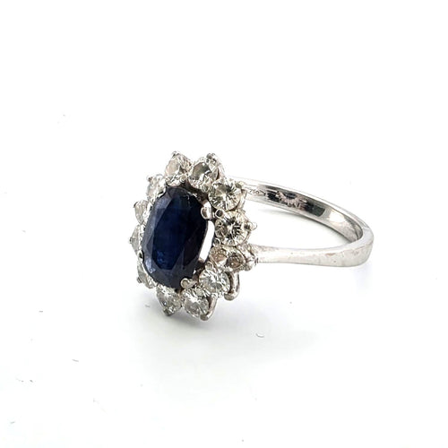 Anello en or blanc avec saphir central et diamants