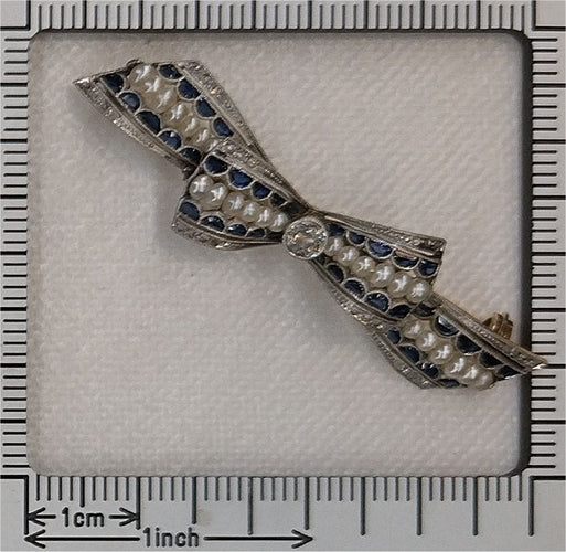 Broche Broche nœud vintage des années 1910 en saphirs et perles – Belle Époque Grace 58 Facettes 25191-0322