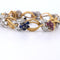 Bracelet Bracelet en or jaune orné de diamants et de pierres de couleur 58 Facettes