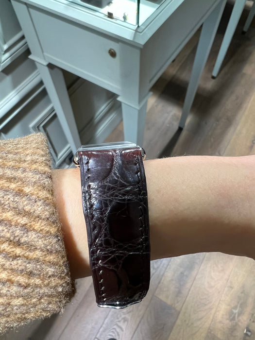 Montre vintage Louis Leuba avec chiffres romains et bracelet en cuir marron