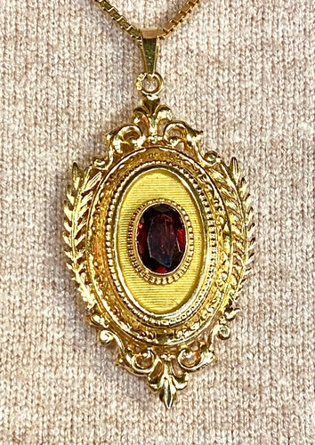 Pendentif Pendentif porte souvenir ouvrant en or et grenat 58 Facettes AB574