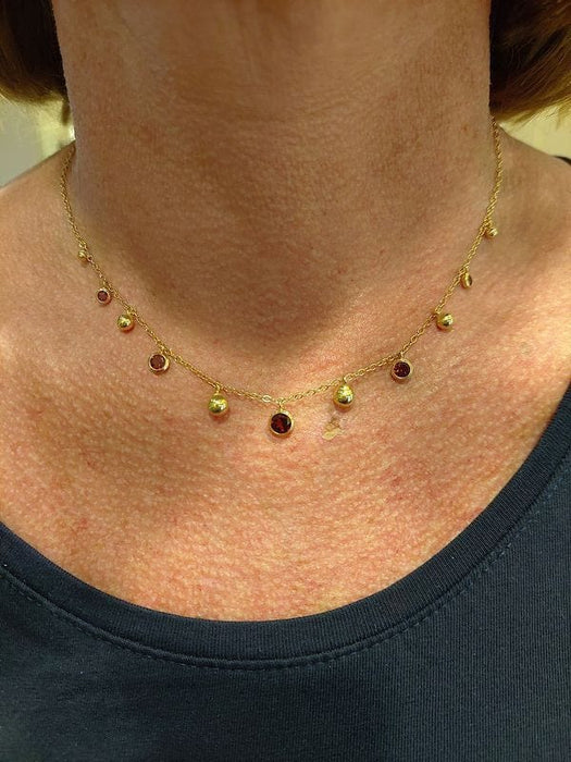 Collier Collier moderne or jaune grenats 58 Facettes 091831