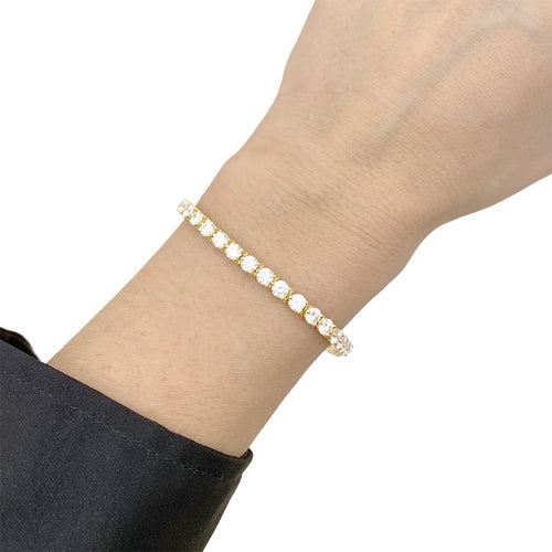 Bracelet Bracelet ligne Cartier, or jaune et diamants. 58 Facettes 35137