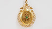 Pendentif Pendentif porte photo en or jaune et émeraude 58 Facettes 32604