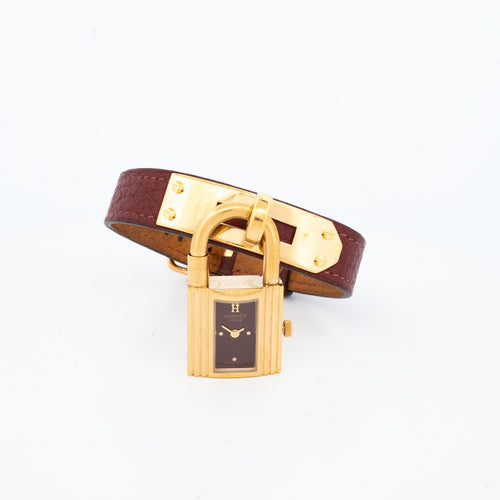 Hermès - Montre Kelly en acier doré, cadran bordeaux 58 Facettes