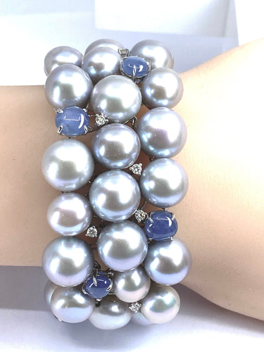 Bracelet Important bracelet or blanc, saphirs étoilés, diamants et perles grises 58 Facettes AB632