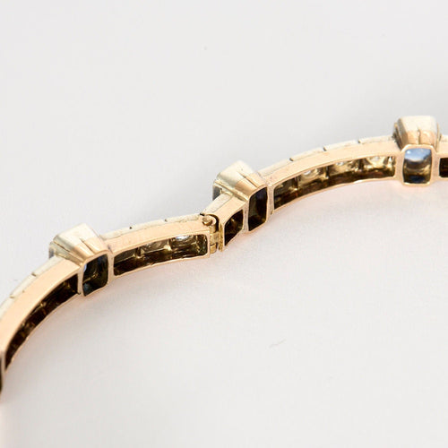 Bracelet jonc ouvrant en or jaune et argent, diamants et saphirs 58 Facettes 230460
