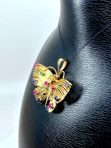 Pendentif papillon en or jaune et pierres précieuses