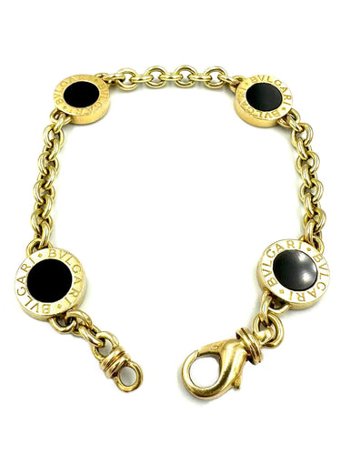 Bracelet BVLGARI. Collection "BVLGARI-BVLGARI", bracelet or jaune et onyx 58 Facettes