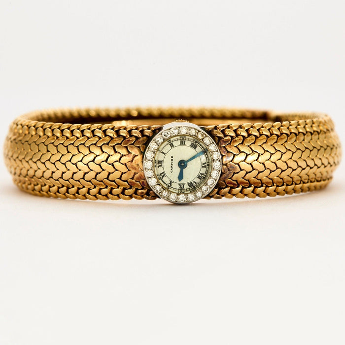 Bracelet CARTIER – VINTAGE – Bracelet montre de dame en or jaune et or blanc 58 Facettes