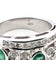 Bague Bague en or blanc des années 1970 avec émeraudes et diamants 58 Facettes