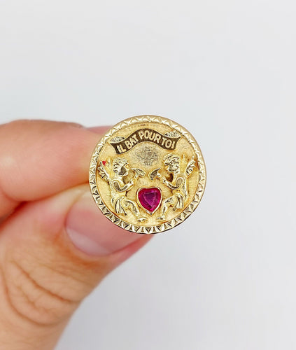 Bague 55 Bague vintage "il bat pour toi" or rose, angelots sculptant un coeur en rubis synthétique 58 Facettes A05267