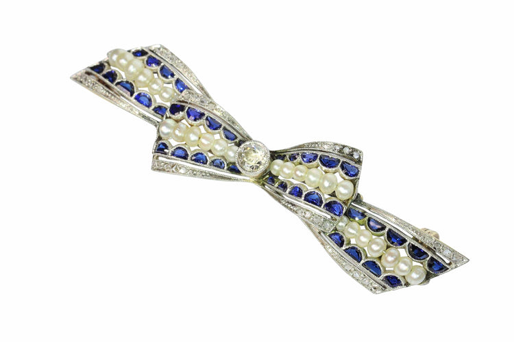Broche Broche nœud vintage des années 1910 en saphirs et perles – Belle Époque Grace 58 Facettes 25191-0322