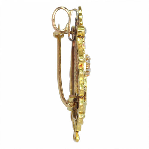 Diamants et harmonie : la broche-pendentif lyre en or des années 1870