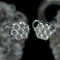 Clips d’oreilles marguerites en or gris et diamants