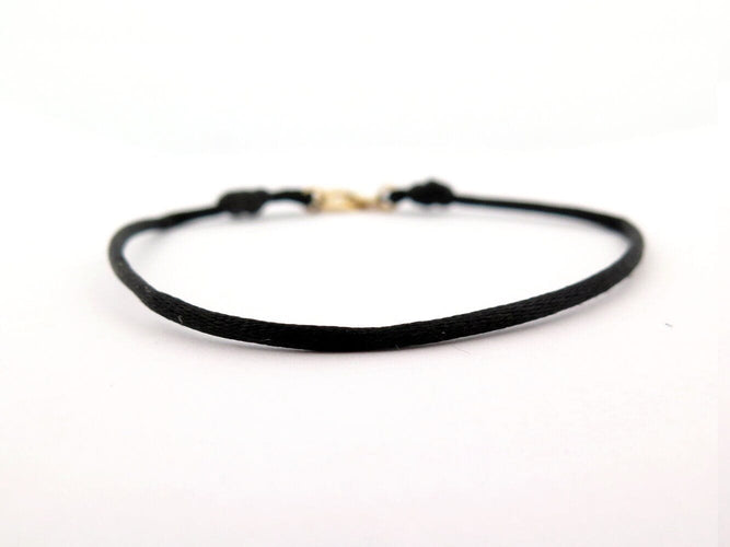 Bracelet bracelet DINH VAN menottes r10 341102 en or jaune 18k 2.9gr & cordon noir 58 Facettes 270151