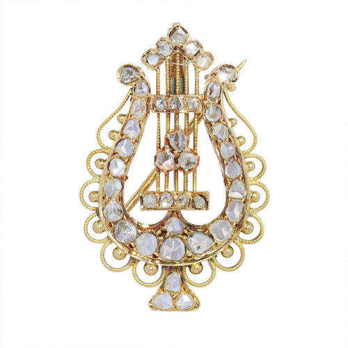 Diamants et harmonie : la broche-pendentif lyre en or des années 1870