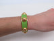 Bracelet bracelet HERMES jonc en cuir vert et metal dore en metal 58 Facettes 272252