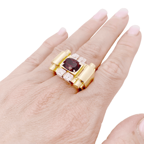 Bague 54 Bague "tank", deux tons d'or, grenat et diamants. 58 Facettes 34577