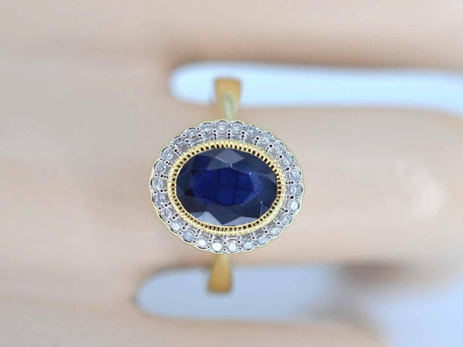 Bague 54 Bague entourage en or avec diamants et saphir 58 Facettes 2142