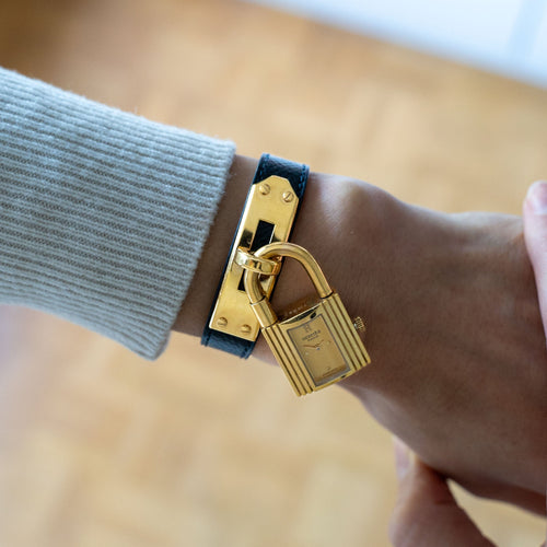 Montre Hermès - Montre Kelly en acier doré et cadran champagne 58 Facettes