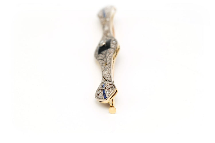 Broche Broche Art Déco sertie d’onyx, saphirs et diamants en or jaune et blanc 18 carats 58 Facettes 23114