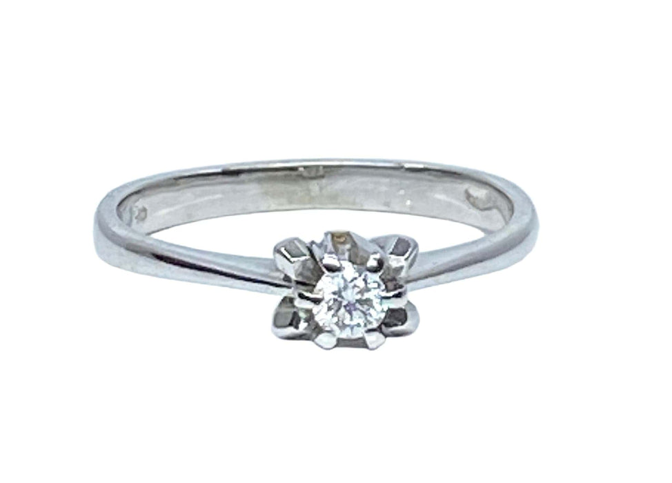 Bague solitaire en or blanc et diamants