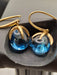 Boucles d'oreilles POMELLATO - Boucles d'oreilles collection Veleno en or jaune et topaze bleue 58 Facettes