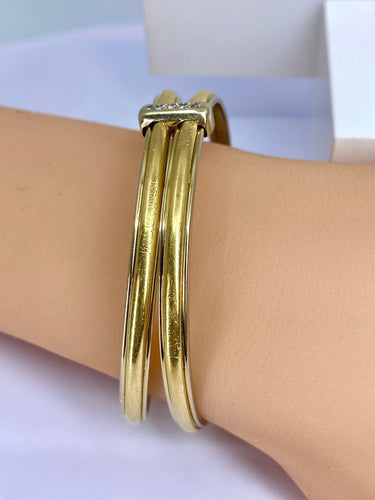 Bracelet Bracelet double joncs, or blanc, diamants, Yves Saint Laurent 58 Facettes AB601